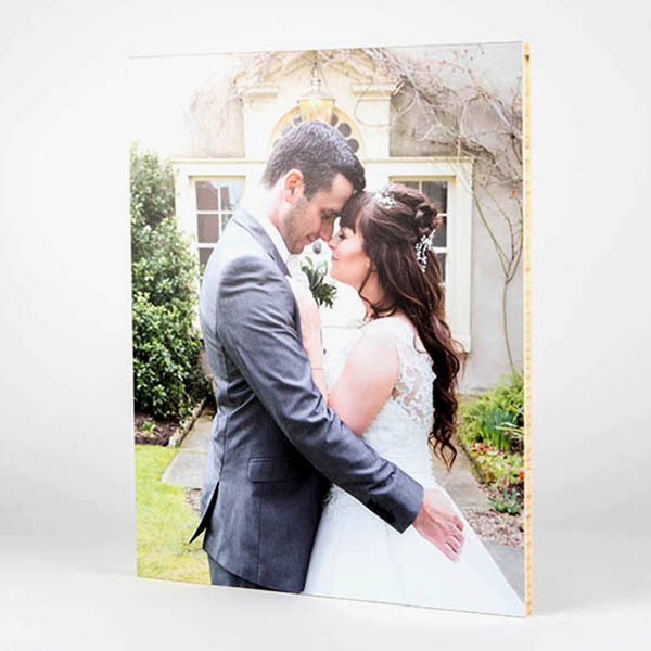 Custom photo wall art of a natural bamboo photo print of a couple on their wedding day