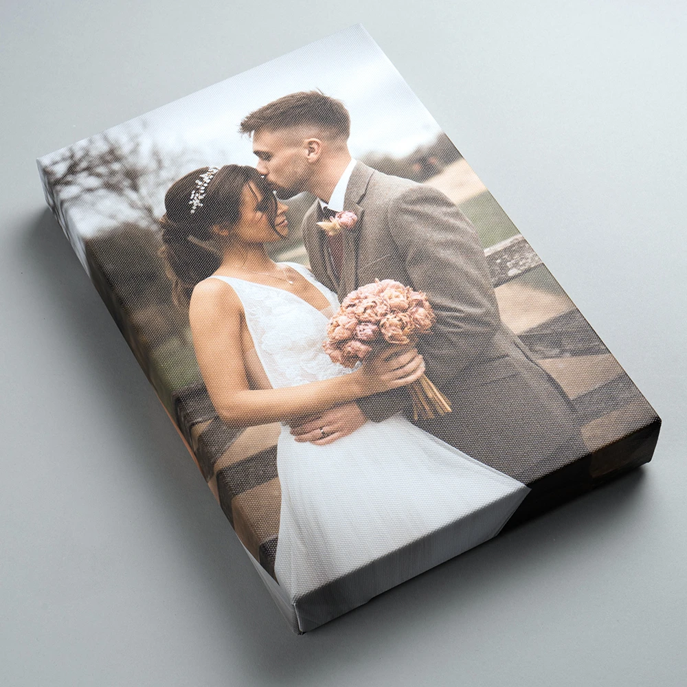 Bespoke photo display product of a high quality canvas print of a couple laughing on gicleé canvas