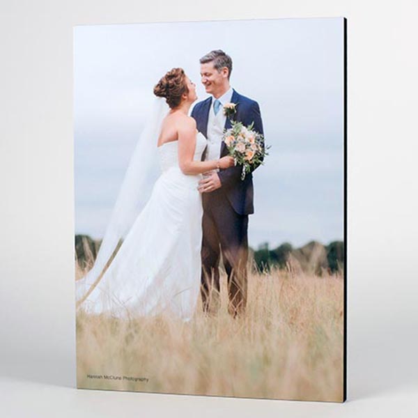 Custom photo wall art of a wooden photo block of a bride and groom outdoors