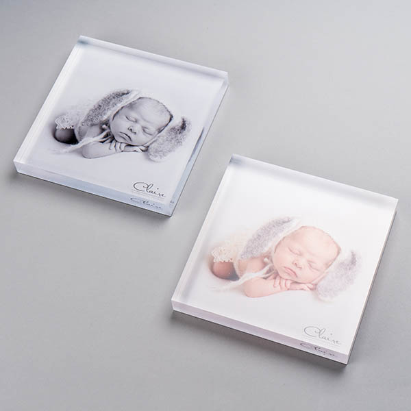 Personalised desk gift of a glass photo block of a baby in the autumn leaves